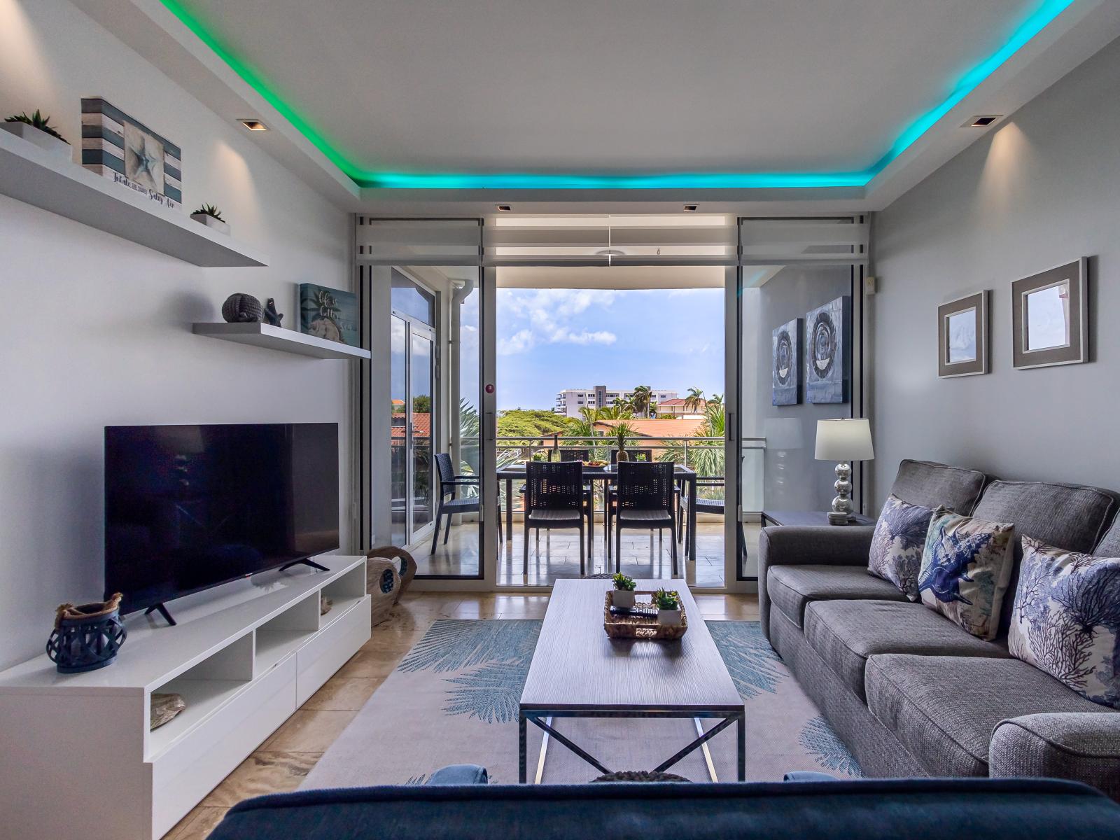 Eclat Living Area of the 2BR Condo in Oranjestad Aruba - Smart TV and Netflix - Cozy seating area conducive to relaxation and socializing - Access to Private Balcony - Outstanding Views