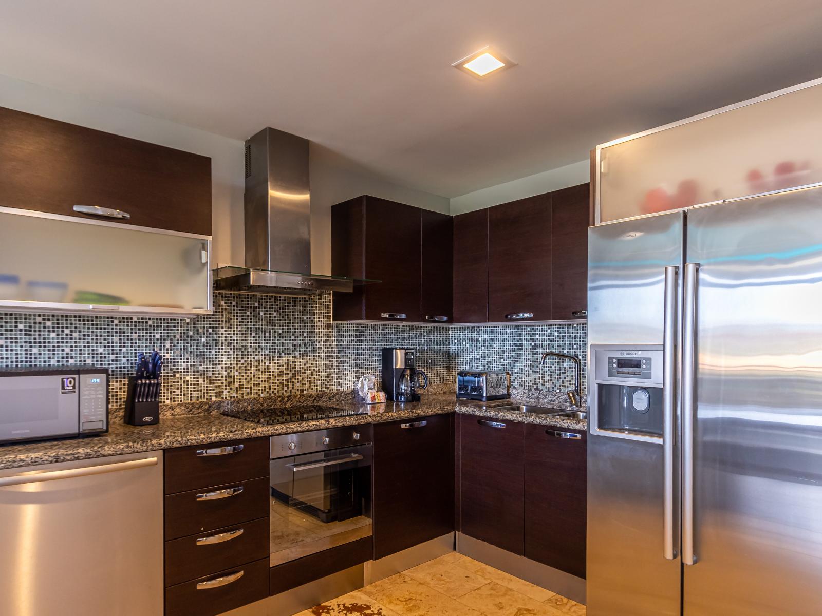 Charming Kitchen of the 2BR Condo in Oranjestad Aruba - Modern kitchen with sleek, stainless-steel appliances - Smart use of space with versatile storage solutions - Fully Equipped - Open concept connecting the kitchen to the dining