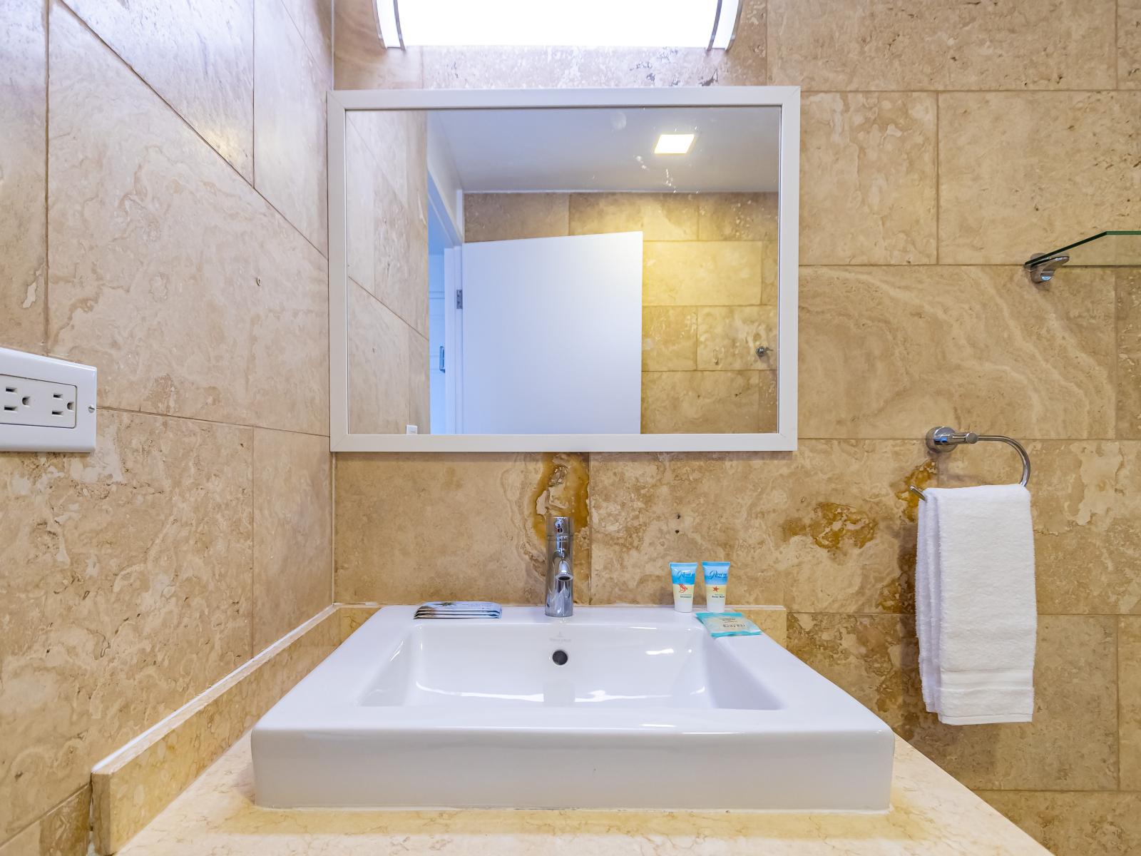 Splendiferous Bathroom of the 2BR Condo in  Oranjestad Aruba - Chic design featuring a sleek vanity and upscale lighting - Contemporary fixtures for a touch of indulgence - Ensuite Bathroom