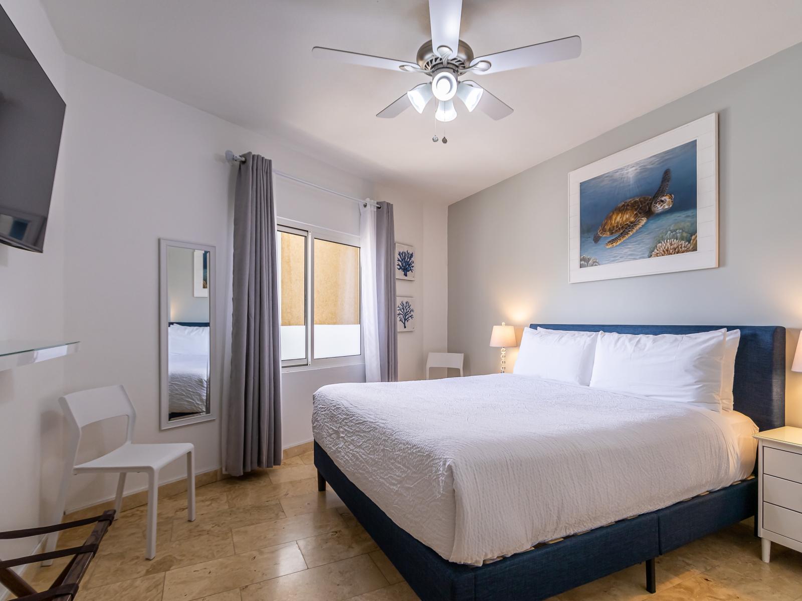 Lofty Bedroom of the 2BR Condo in Oranjestad Aruba - Cozy retreat with a plush bed, perfect for relaxation - Smart TV and Netflix - Modern and stylish decor that complements the space