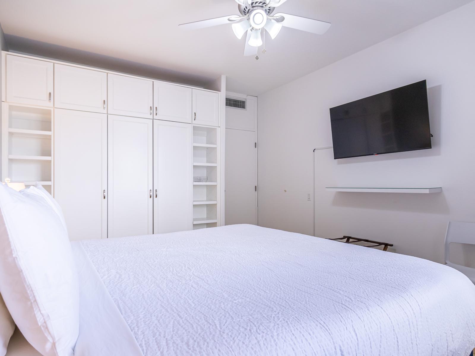 Bedroom 2 with King bed, tv and attached bathroom