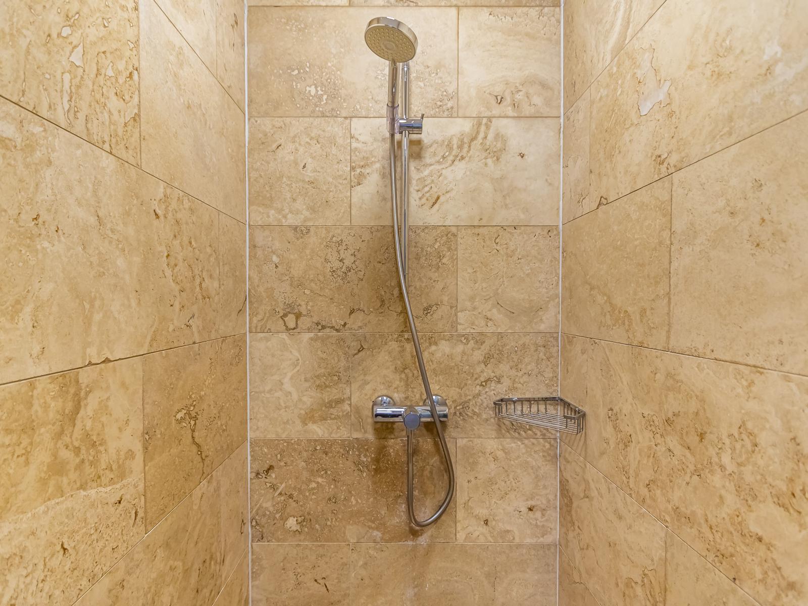 Indulge in comfort and convenience in the second bedroom's bathroom, boasting a modern walk-in shower.