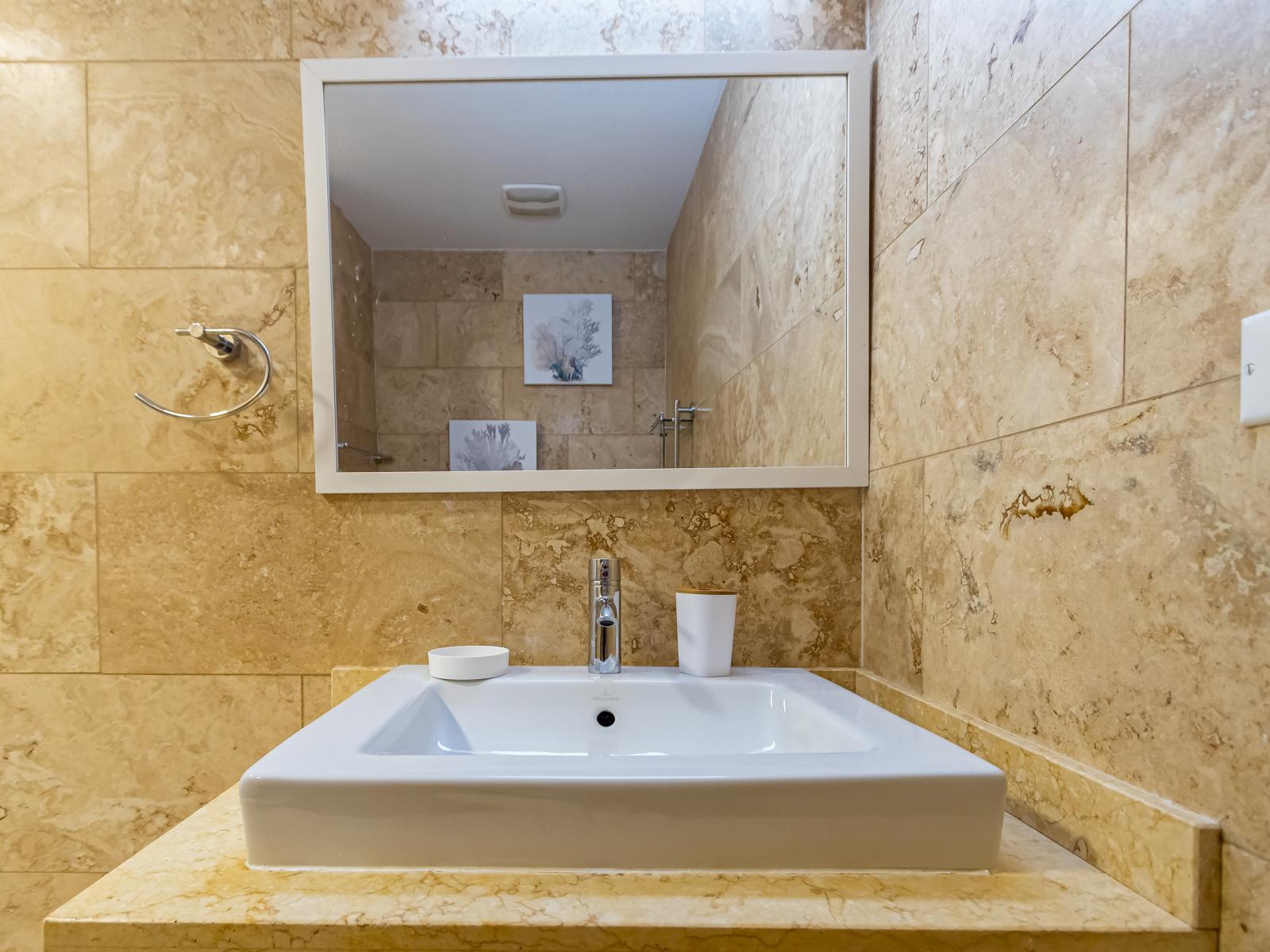 Refresh and renew in the second bedroom's bathroom, featuring a sleek walk-in shower for your comfort.