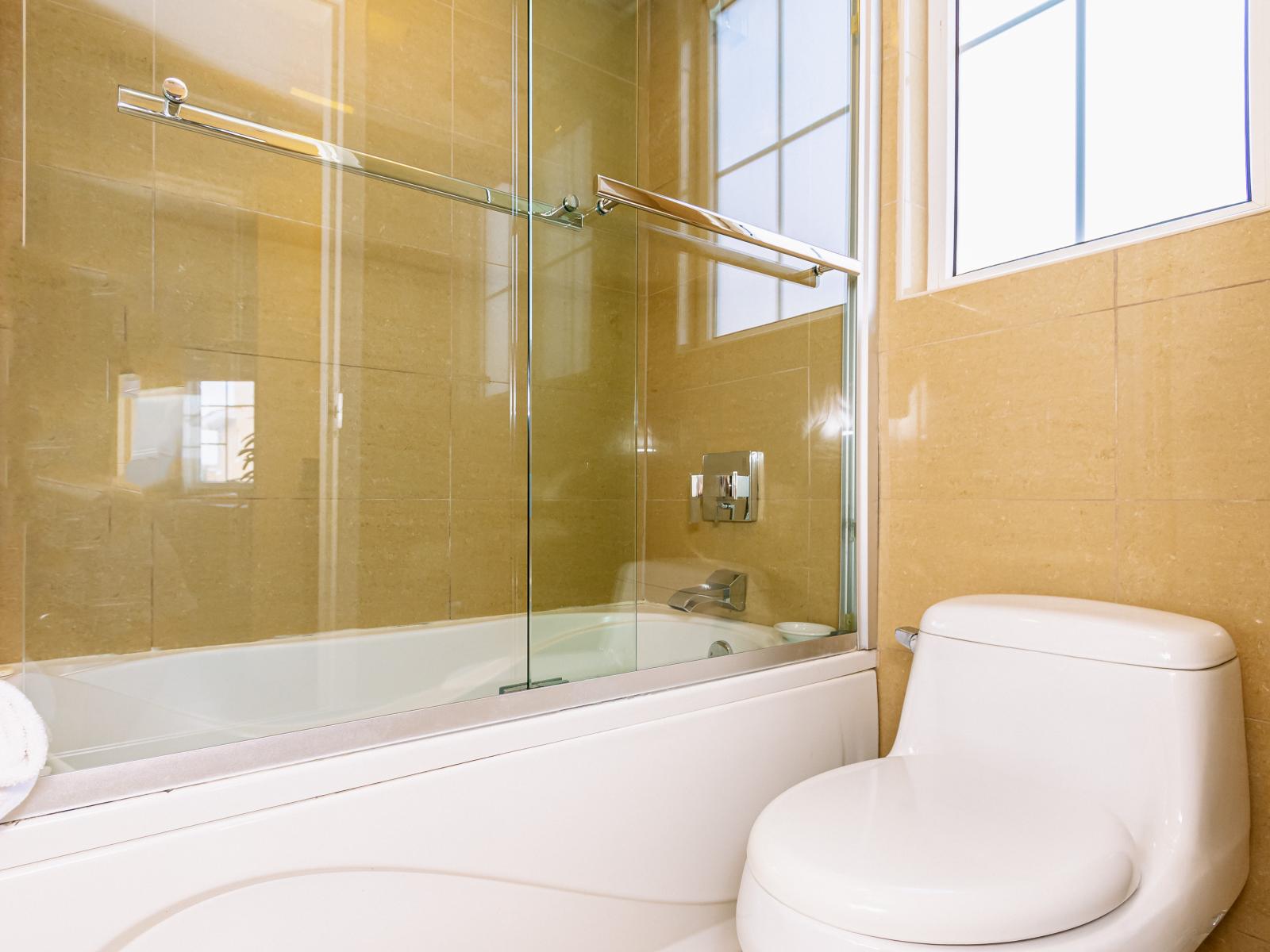 Main bathroom with bathtub- pamper yourself in this area with the bathroom so tranquil