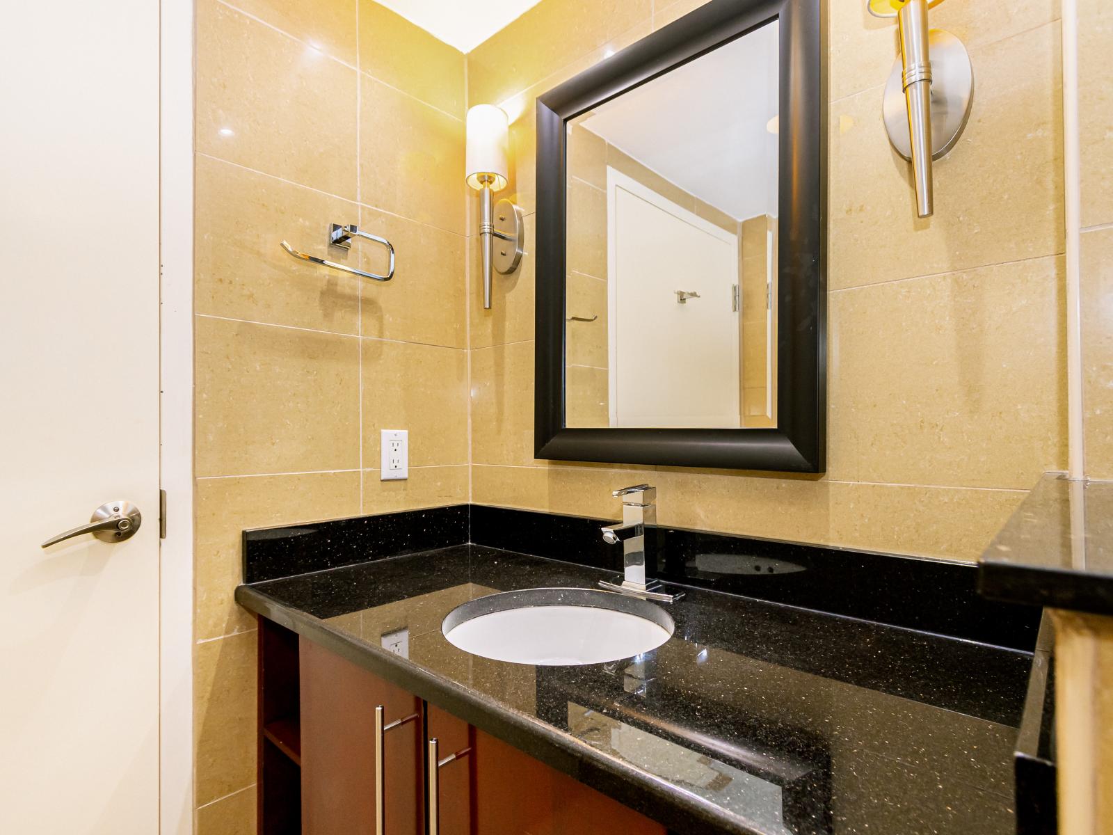 Step into luxury and convenience in Bathroom 2 with our refreshing walk-in shower. Save yourself from the hassle and treat yourself to a moment of cleanliness and pampering.