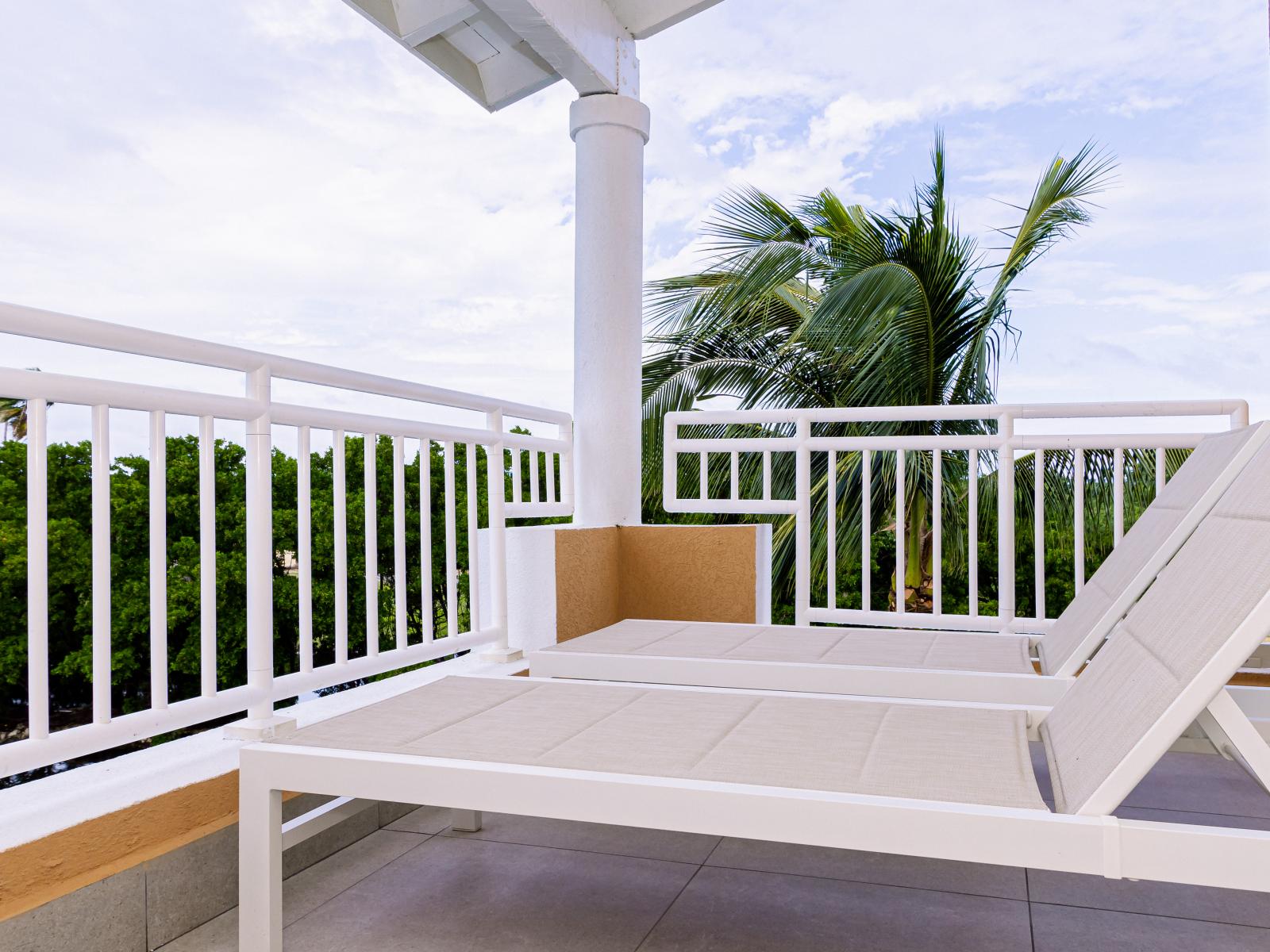 The balcony has beautiful garden and sunset views