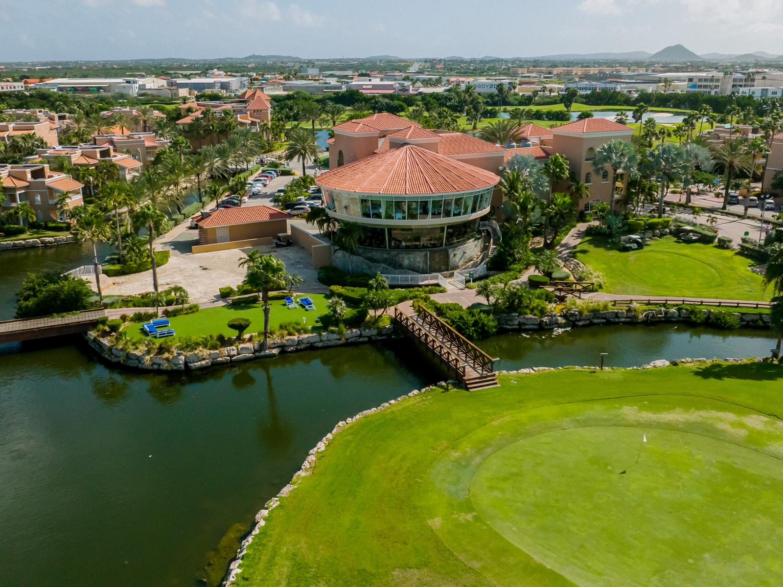 Discover the perfect blend of culinary delights and scenic views at Windows by Aruba Restaurant, overlooking the pristine greens of Divi Village's renowned golf course.