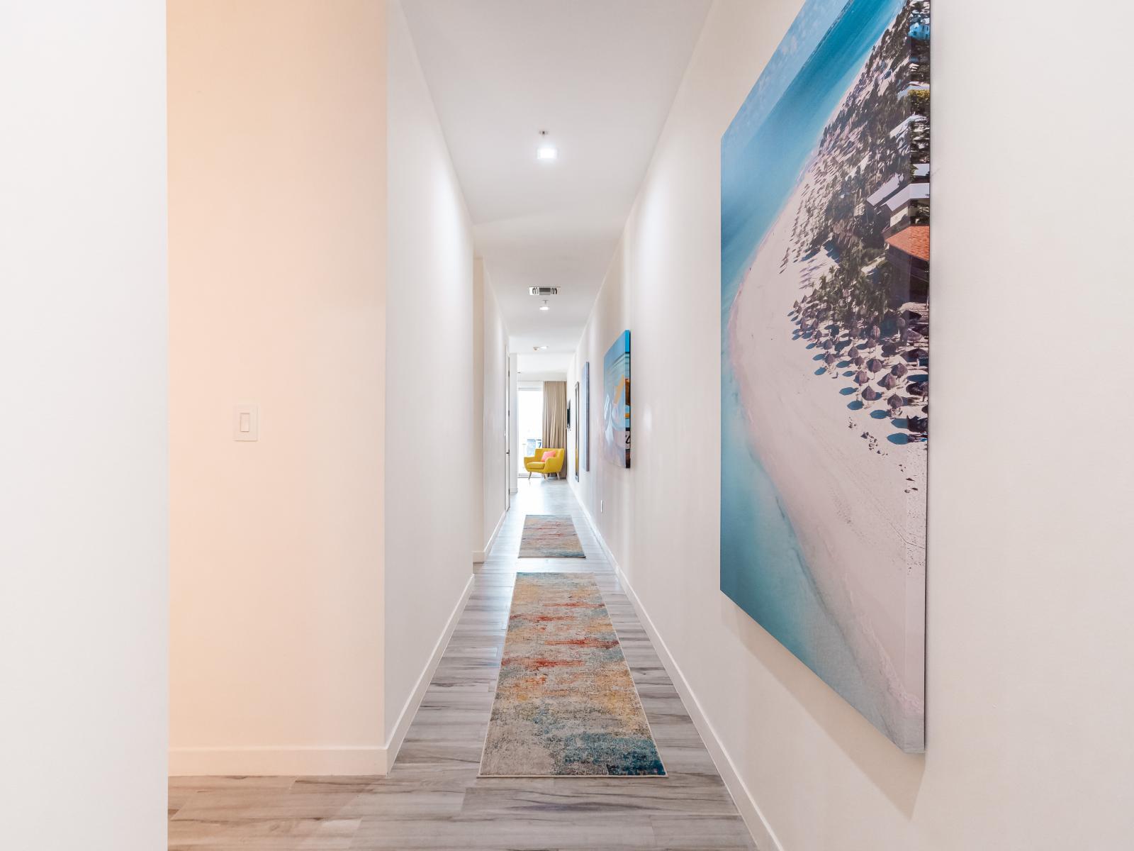 The inviting hallway leads to the bedrooms, providing a serene pathway to your restful and personal spaces.