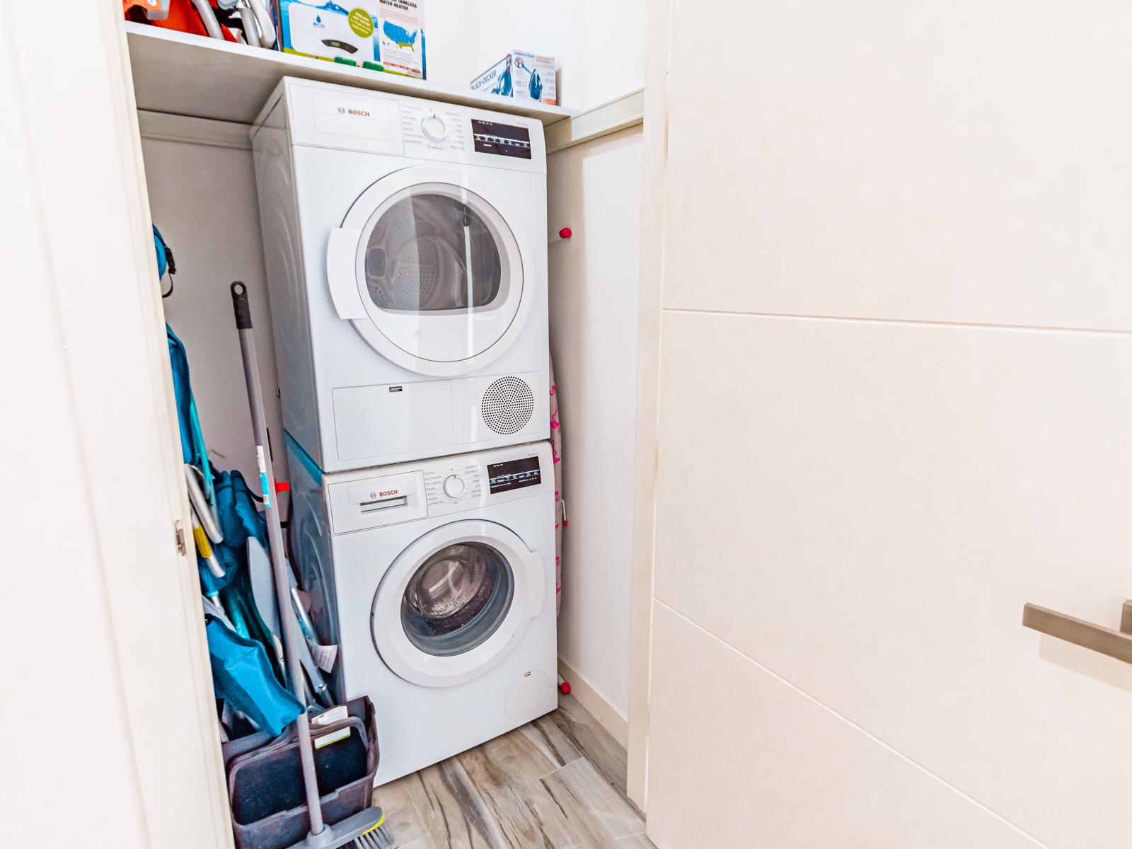 Laundry room with, washer, dryer and some other supplies for guests