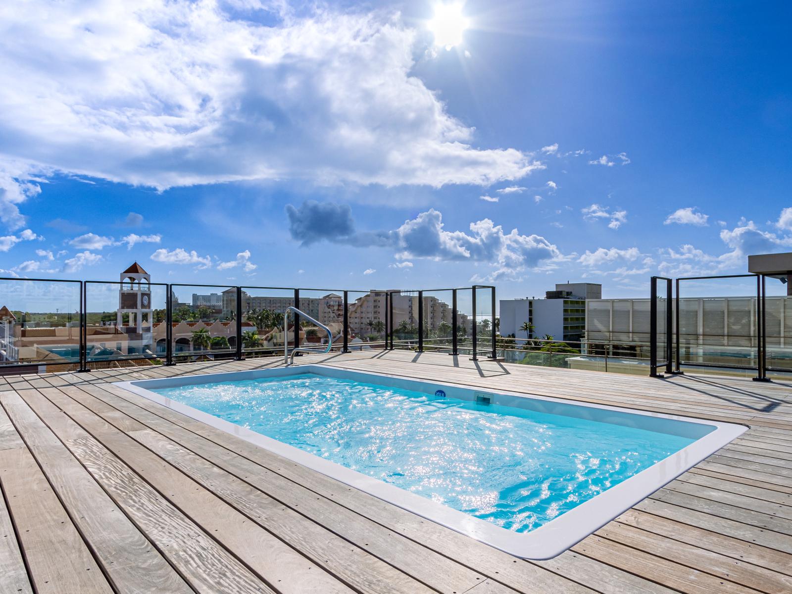 Roof top pool with a great view of hotels and restaurants