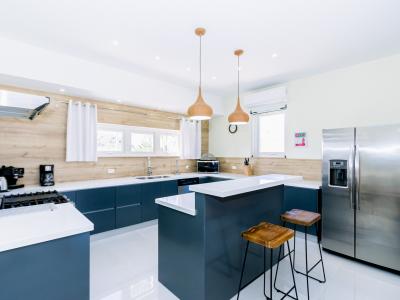 Well-Designed Kitchen of the 4BR Home in Noord Aruba - Ample storage space for organized and clutter-free counters - Open concept connecting the kitchen to the dining or living area - Thoughtful placement of kitchen essentials for easy access