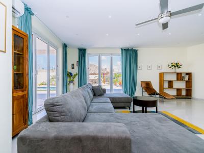 Spacious living room with wall mounted flat screen TV