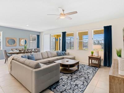 Captivating living area of the home in Davenport Florida - Retreat where relaxation meets elegance - Plush sofas to relax and unwind - Fine finishes and attention to detail throughout