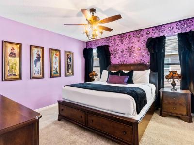 Haunted Mansion Theme of the home in Davenport Florida - Modern bedroom with sleek design - Thoughtfully designed bedroom featuring functional and stylish furniture - Elegantly themed