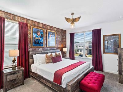 Lavish Bedroom of the Townhouse in Davenport Florida - The bedroom that is inspired by a harry potter themed design - Cozy retreat with a plush bed, perfect for relaxation - Smart use of space with efficient storage solutions