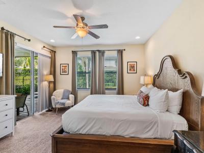 Luxury Bedroom of the Home in Kissimmee Florida - Adorned with Exquisite Furnishings  - Smart TV and Netflix - Access to outdoors with seating - Comfy double sized bed