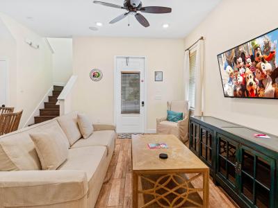 Living Room w/Wall-Mounted Flat-Screen TV - Have fun watching TV in this comfy couch and wall-mounted flat-screen Smart TV!