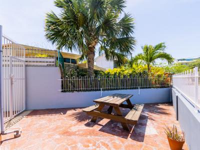 Beautiful Patio area of the Studio apartment in Oranjestad, Aruba - Great entrance - Stunning sitting table - Completely sunbathed space - Refreshing and soul enhancing environment