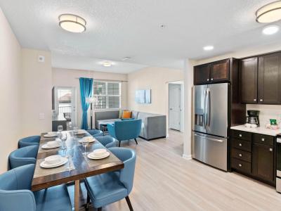 Marvelous dining area of the townhouse at Vista Cay Resort - Embodies elegance and warmth, providing guests with a tasteful setting to enjoy culinary delights. - Stunning wooden furnished floor - Cozy ambiance