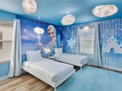 Frozen themed bedroom of the home in Kissimmee Florida - Beautiful lighting fixtures - Offers two single beds for restful nights - Inviting atmosphere designed for a restorative sleep