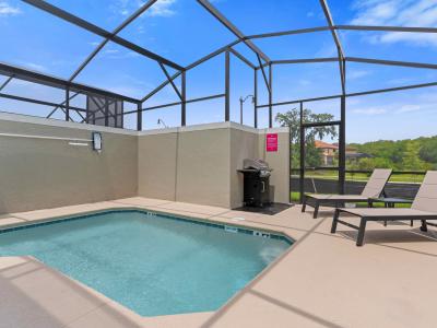 Amazing private pool of the townhouse in Kissimmee Florida - A peaceful atmosphere where you can relax and unwind - Sparkling waters beckoning you to take a leisurely swim - Comfy lounge chairs and BBQ for added convenience