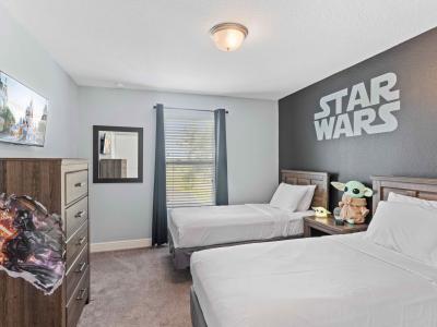 Star Wars themed kids room with 2 single beds