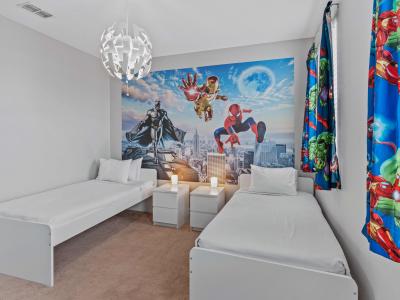 Marvel and DC Themed Bedroom of the Townhouse in Davenport Florida - Drift into a world of adventure in our Hero-themed bedroom - Twin Single beds set the stage for a supercharged stay