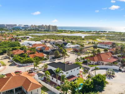 An aerial view demonstrating the home's proximity to high-rise hotels and its convenient location within the hotel district, as well as its close proximity to the beach.