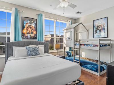 Marvelous Bedroom of the townhouse in Orlando - Featuring a queen-size bed and a bunk bed for kids with Disney themed decor - Amidst a cozy elegance and thoughtful design. - Availability of smart Tv and Netflix - Neat and clean linen