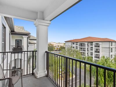 Aerial Retreat private balcony of the condo in Orlando Florida - Panoramic stunning view visible from the balcony - Relaxing seating on the balcony, providing  comfortable spaces to unwind