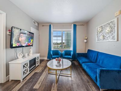 Enchanting living area of the condo in Orlando Florida - Cozy seating area conducive to relaxation and socializing - Chic and contemporary living room design with clean lines and modern furnishings - Well-designed space