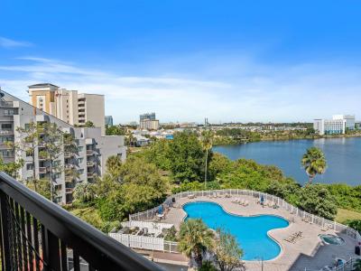 Balcony overlooking the pool and lake with great views of Universal from afar