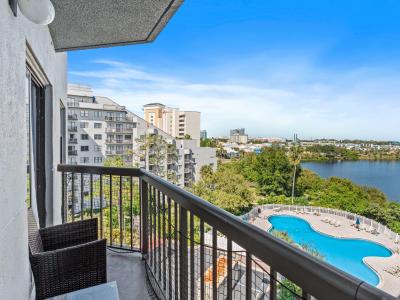 Balcony overlooking the pool and lake with great views of Universal from afar