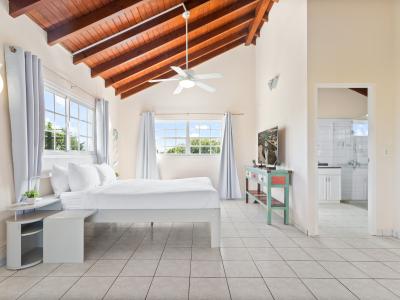 Spacious Bedroom of the home in Noord Aruba - Attached bathroom  - Elegant space with sense of tranquility - Private Balcony