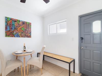 Chic Dining Area of the Apartment in Noord Aruba - Dining area for two - Quality materials, such as a sleek dining table and comfortable chairs - Harmonious color scheme for a cohesive and stylish look