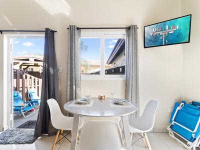 Elegant Dining Area of the Apartment in Noord Aruba -  2 Persons Dining - Smart TV and Netflix - Artfully arranged table settings for a touch of elegance - Access to outdoors - Beautifully crafted dining table