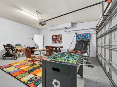 Refreshing Game Room of the Home in Kissimmee Florida - Enjoy Competitive Fun in the Game Room with a Foosball Table - A vibrant atmosphere that ignites the spirit of play and competition