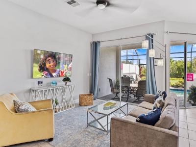 Scenic Living Area of the Townhouse in Davenport Florida - View of the pool from the outside - Smart TV and Netflix - Cozy seating area conducive to relaxation and socializing