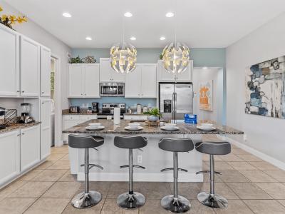 Sleek Kitchen of the Townhouse in Davenport Florida - Efficient open concept kitchen  - Fully equipped  - Breakfast Bar and high chairs - Well-lit workspace with strategically placed task lighting