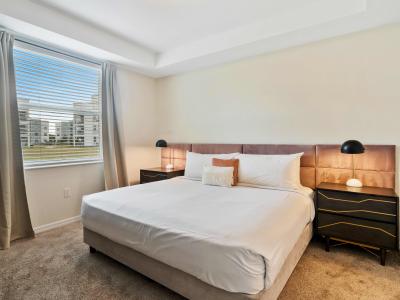 Phenomenal Bedroom of the Condo in Kissimmee Florida - Cozy king size bed and a private bathroom - Spacious bedroom offering comfort and style - Outstanding outside views from the large window