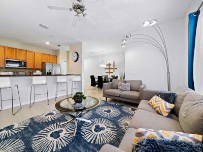 Elegant Living area of the Townhouse in Kissimmee Florida - Beautiful living room with an open layout, creating a sense of spaciousness - Stylish furniture arrangement providing comfort and a cohesive look - Cozy Sofas