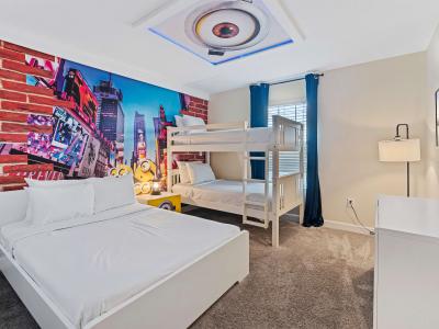 Minion themed bedroom of the townhouse in Kissimmee Florida - Offers a double bed and a bunker bed - Thoughtfully designed bedroom featuring functional and stylish furniture - Smart TV to enjoy your favorite shows