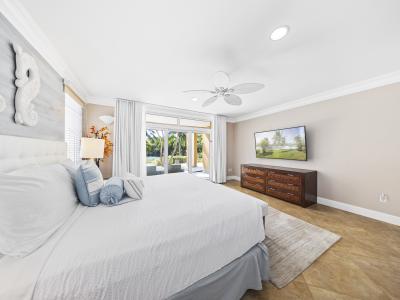 Bedroom 3 features a king size bed and access to the patio