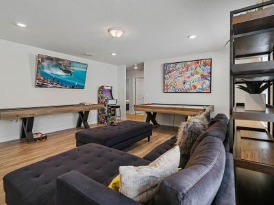 Loft area with arcade games, air hockey table and shuffle table board