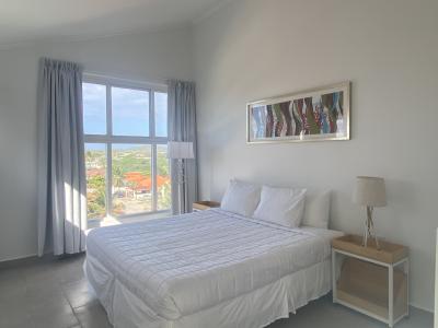 The bedroom with lots of natural light coming in