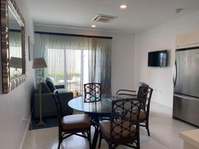 Spacious living room with access to the patio, where a outside dining table waits