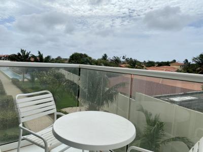 Start your day with coffee on this private balcony, surrounded by swaying palms - Unwind with open views, fresh air, and the perfect spot to soak in Aruba’s charm - Just steps from the pool and minutes from white sand beaches, paradise awaits