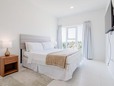 Bedroom 2 features a king size bed and big windows