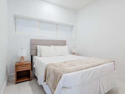 bedroom 1 with a queen size bed and high ceilings