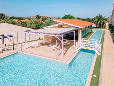 Shared refreshing pool with plenty of lounge chairs to soak up the sun